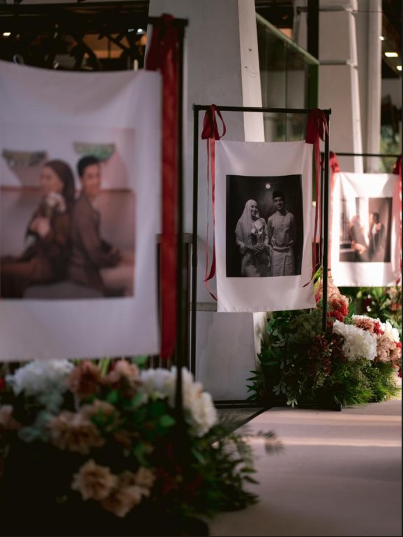 Personalised wedding photo signage on a floral stand