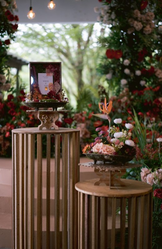 Wedding welcome area — photo signage and mahar frame with everlasting florals on gold plinths